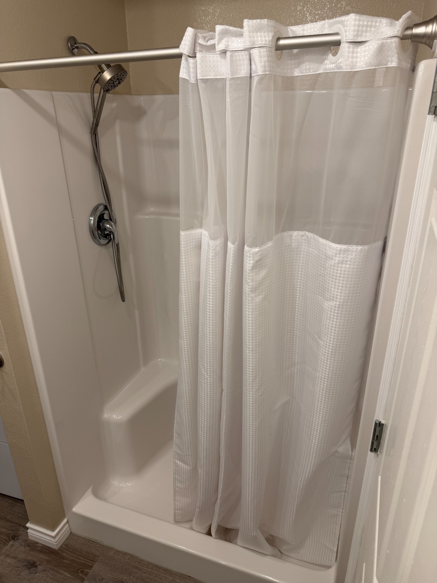 Lonestar at Starlite Ranch walk-in shower with handheld showerhead on US-77 South