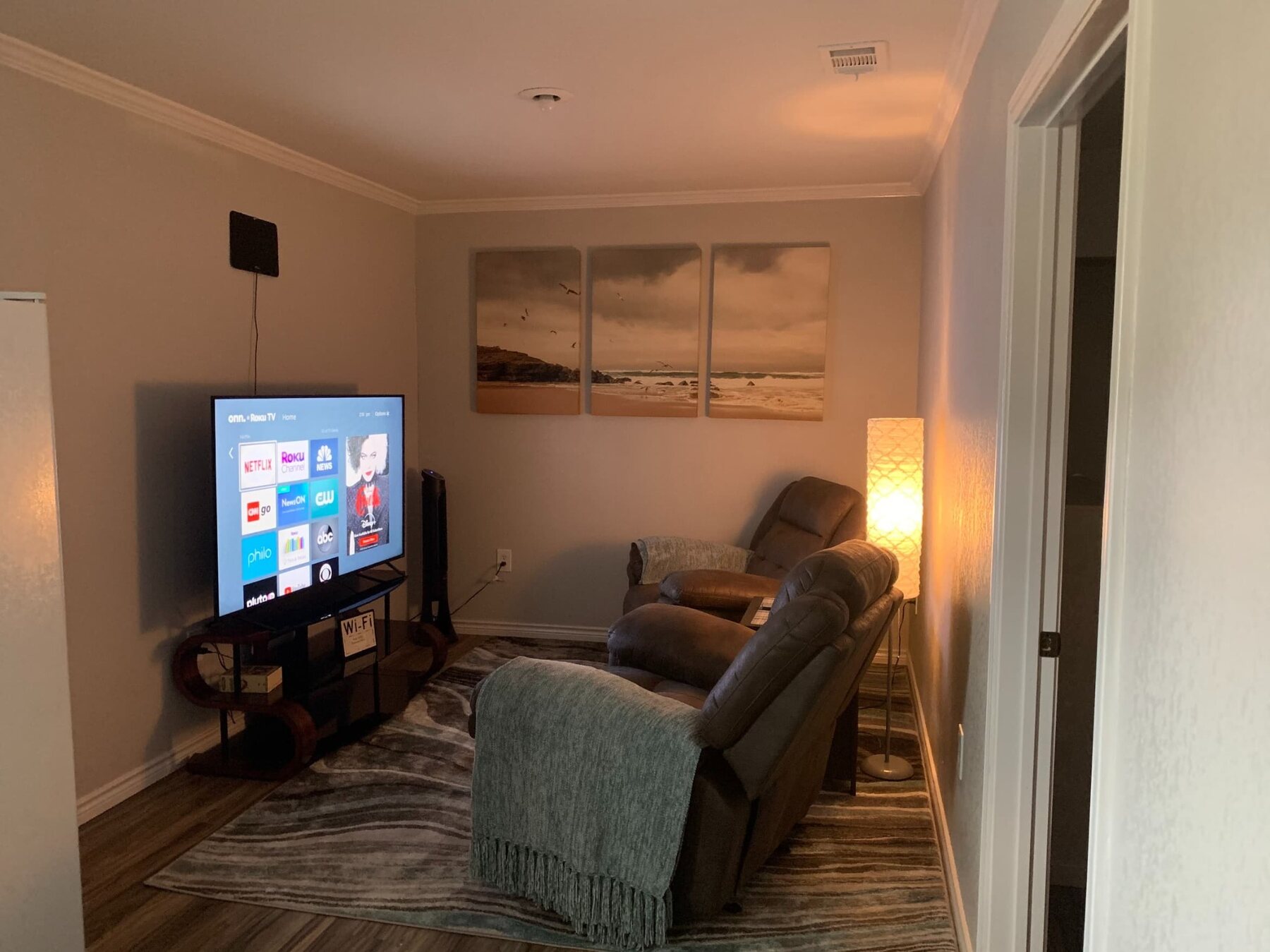 Wren B living room with recliners and television