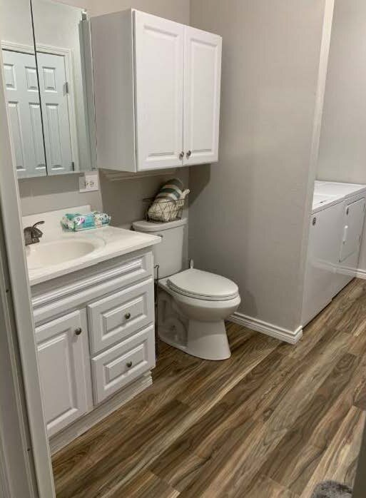 Wren B bathroom vanity, toilet and laundry area