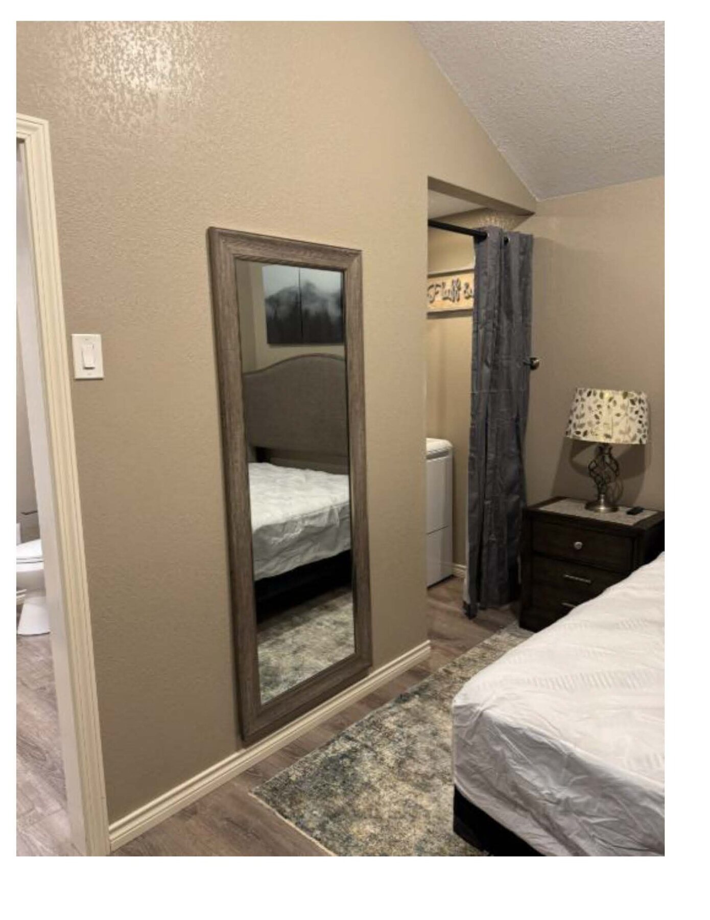 Wren C bedroom with bed and mirror